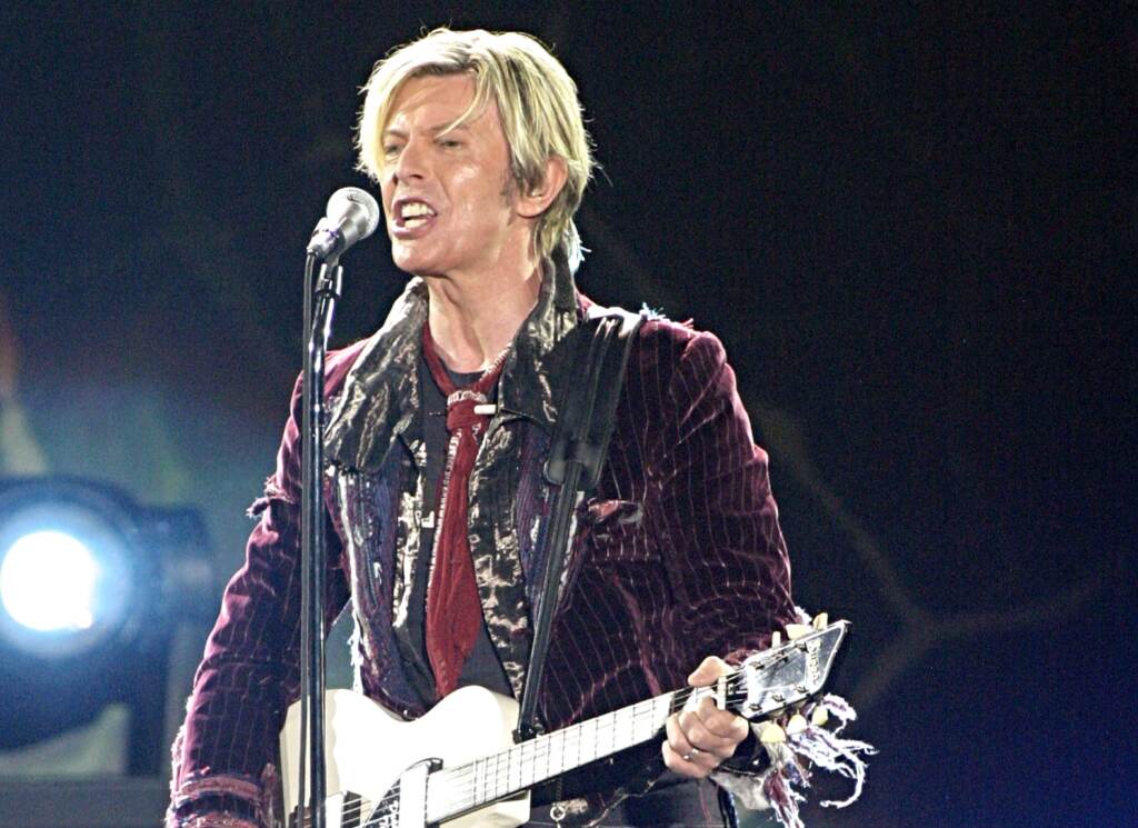 AP52608944469 newsl File photo: In this May 8, 2004 file photo, David Bowie performs at Chastain Park Amphitheatre in Atlanta.