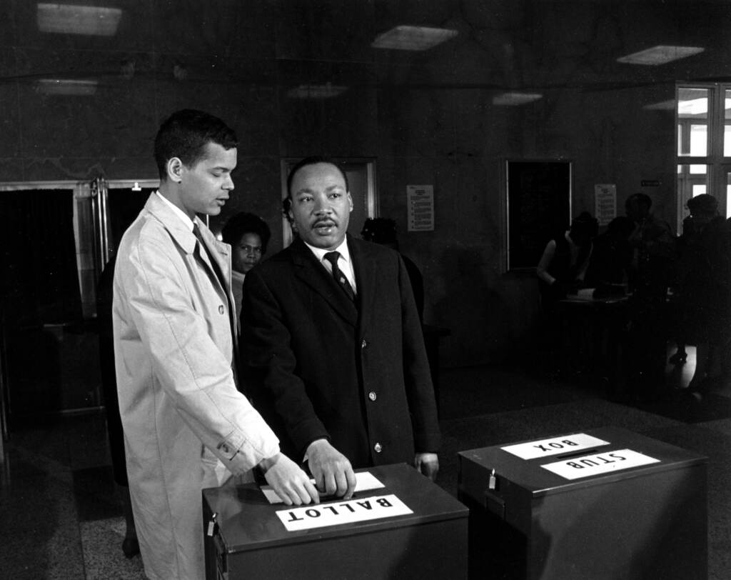JULIAN BOND MARTIN LUTHER KING A photo of Julian Bond and Dr. Martin Luther King Jr. casting their ballots to fill Bond's vacant seat in the U.S. House of Representatives in Atlanta, Ga., on Feb. 23, 1966. (AP Photo)