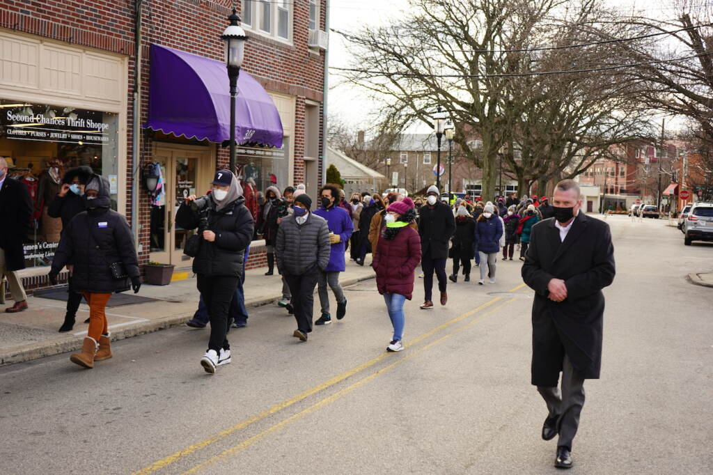 Community members walk towards the Symbol of Solidarity mural alongside elected officials Community members walk towards the Symbol of Solidarity mural alongside elected officials. (Kenny Cooper/WHYY)
