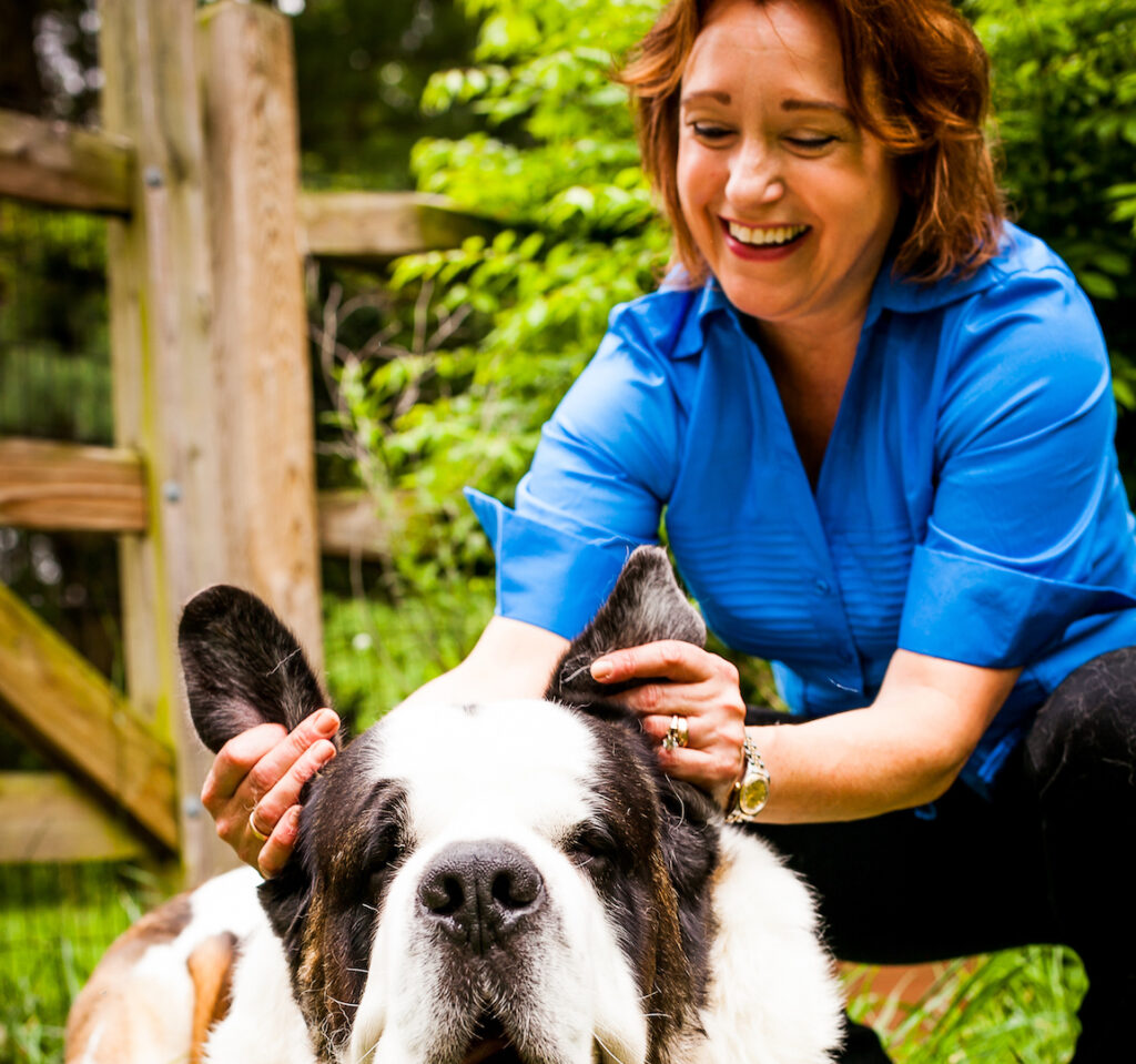 Penny Ellison with her former dog, Shaq. Penny had led Hand2Paw for more than a decade. Photo provided.
