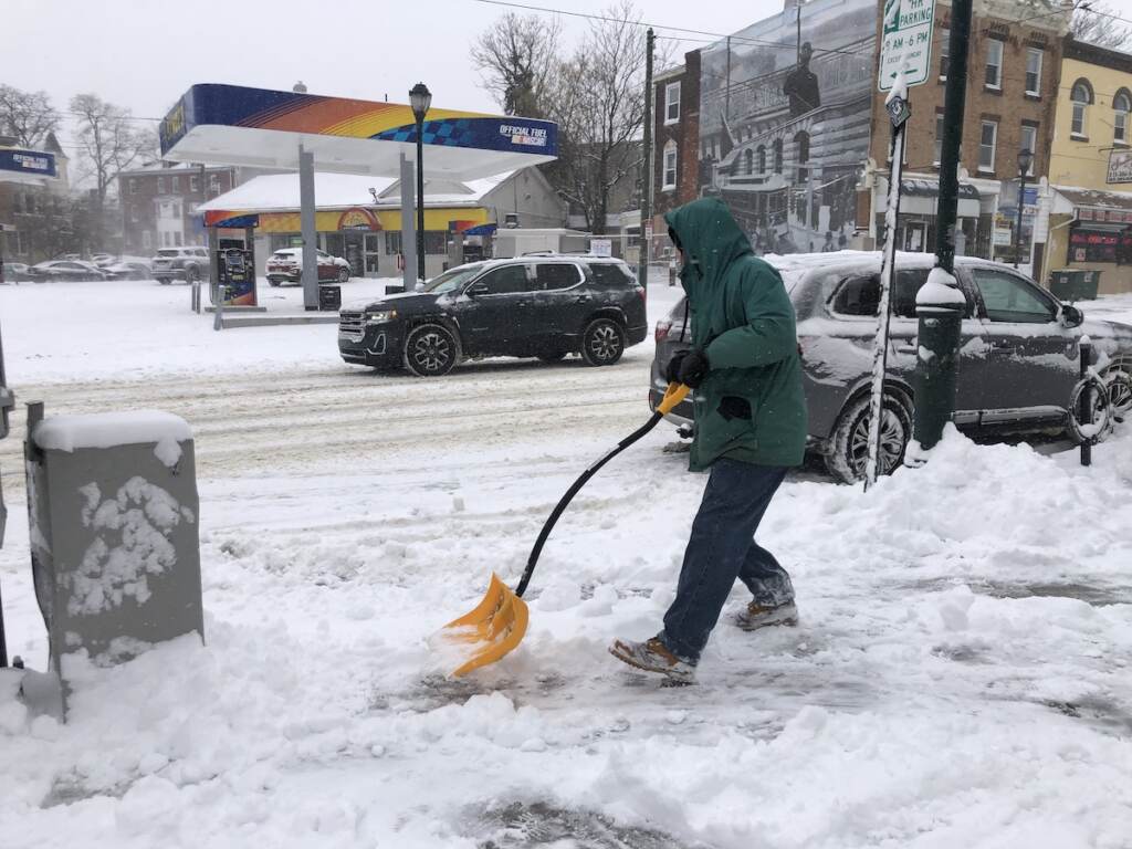 Michael Greene shoveling snow on Baltimore Avenue, West Philadelphia. Michael Greene shoveling snow on Baltimore Avenue, West Philadelphia