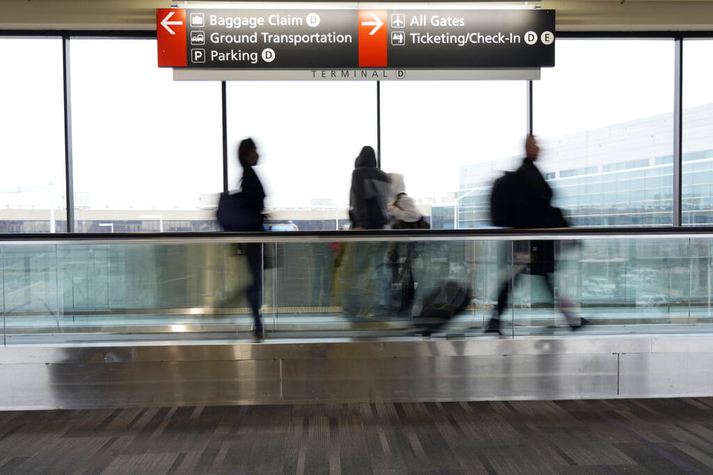 Virus Outbreak Canceled Flights Travelers walk to their gates at the Philadelphia International Airport