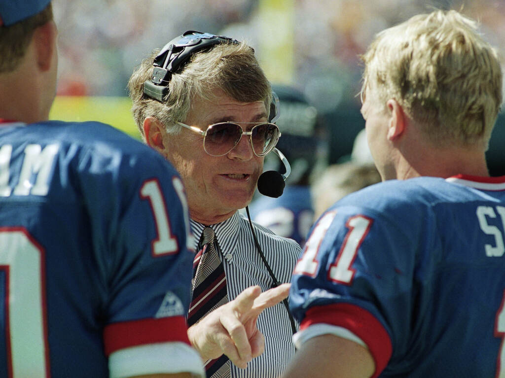Dan Reeves, former coach of the New York Giants, Denver Broncos and Atlanta Falcons died at 77 Saturday. With a career spanning 39 years, he was one of the most successful coaches in NFL history. FILE - New York Giants head coach Dan Reeves gives some instructions to his starting quarterback Phil Simms during the third quarter of their game against the Tampa Bay Buccaneers at Giants Stadium in East Rutherford, N.J. on Sunday, Sept. 12, 1993. Reeves, who won a Super Bowl as a player with the Dallas Cowboys but was best known for a long coaching career highlighted by four more appearances in the title game with the Denver Broncos and Atlanta Falcons, died Saturday, Jan. 1, 2022. (AP Photo/Mark Lennihan, File)