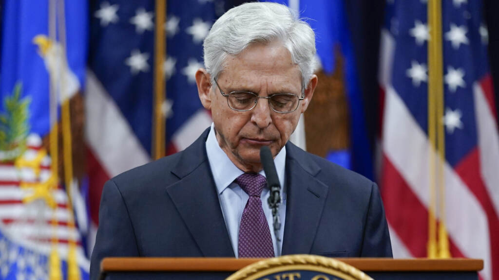 Attorney General Merrick Garland pauses as he speaks at the Department of Justice in Washington on Wednesday, in advance of the one year anniversary of the attack on the U.S. Capitol. (Carolyn Kaster/AP)