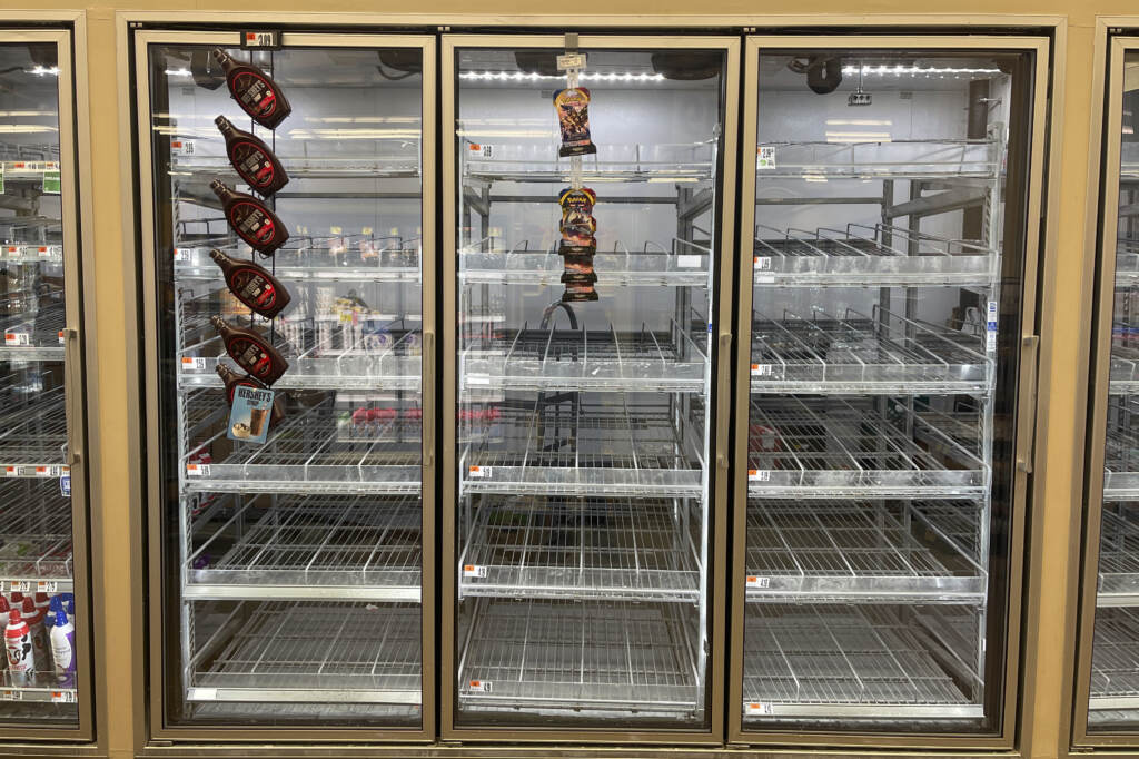 The milk shelf is mostly empty at a Giant grocery store on Tuesday in Washington, D.C. The milk shelf is mostly empty at a Giant grocery store on Tuesday in Washington, D.C. (Parker Purifoy/AP)
