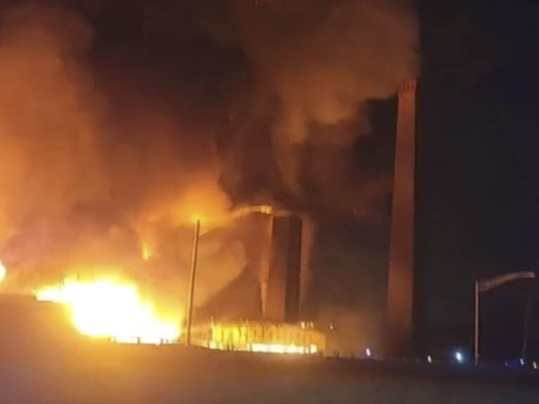 This image from video provided by Mikey B shows a fire near a New Jersey chemical plant, Friday, Jan. 14, 2022 in Passaic, N.J. A fire at a New Jersey chemical plant with flames and smoke visible for miles in the night sky Friday has spread to multiple buildings, threatening to reach the plant's chemical storage area, authorities said. (Mikey B via AP)