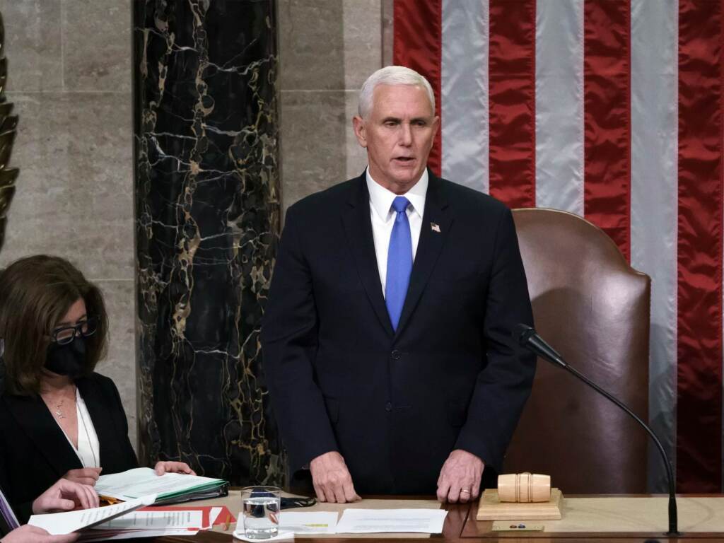 Hours after rioters stormed the Capitol on Jan. 6, 2021, Vice President Mike Pence listens after reading the final certification of the Electoral College votes cast in the 2020 presidential election. File photo: Vice President Mike Pence listens after reading the final certification of Electoral College votes cast in November's presidential election during a joint session of Congress after working through the night, at the Capitol in Washington, Thursday, Jan. 7, 2021. (AP Photo/J. Scott Applewhite, Pool)