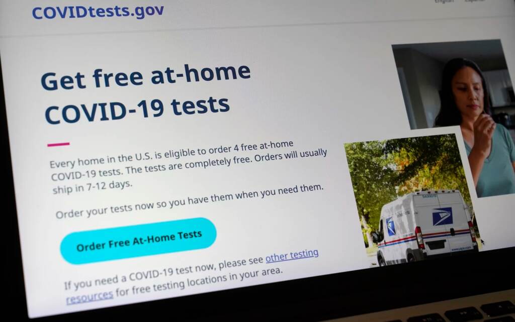 The website COVIDTests.gov allows people to order four at-home tests per residence and have them delivered by mail. Now there’s a phone number, too. A United States government website is displayed on a computer, Wednesday, Jan. 19, 2022, in Walpole, Mass., that features a page where people can order free, at-home COVID-19 tests. The website, COVIDTests.gov, allows people to order four at-home tests per residence and have them delivered by mail