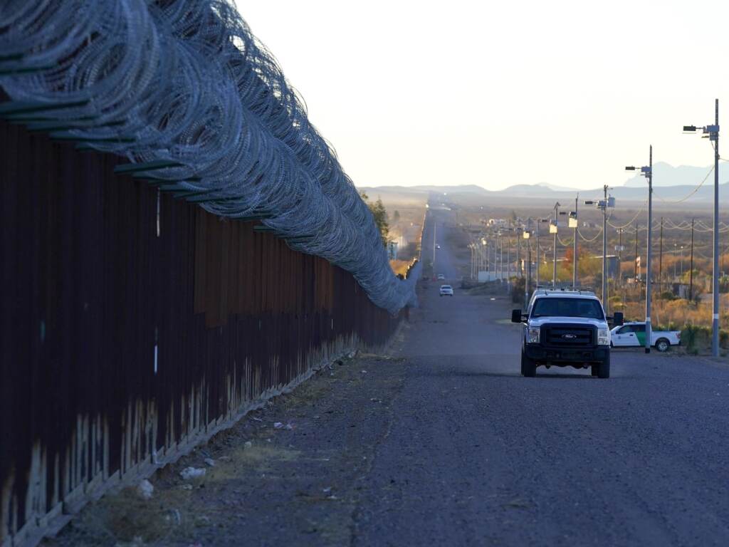 Holidays at the Border A U.S. Border Patrol vehicle drives along the border fence
