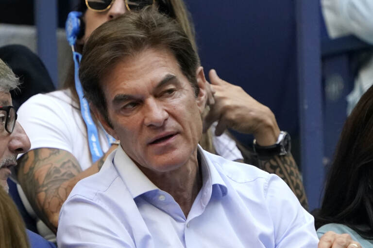 Dr. Mehmet Oz watches play during the women's singles final of the US Open tennis championships