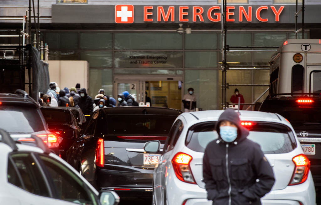 People and cars line up outside of Boston Medical Center