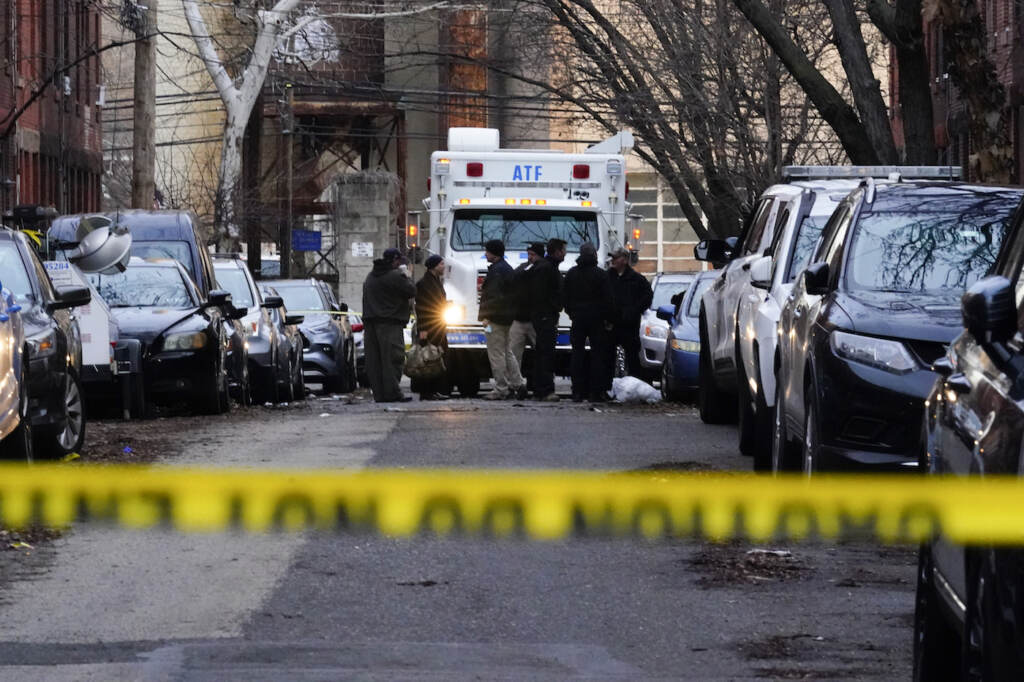 Philadelphia Fire Officials gather by a response vehicle