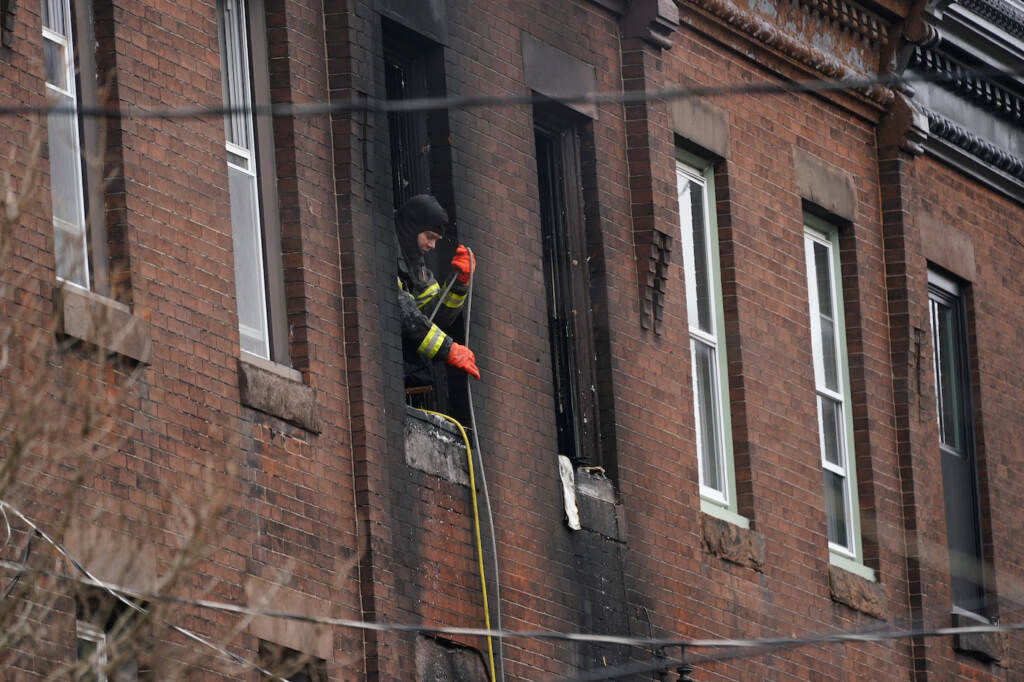 Philadelphia Fire A Philadelphia firefighter works at the scene of a deadly rowhouse fire