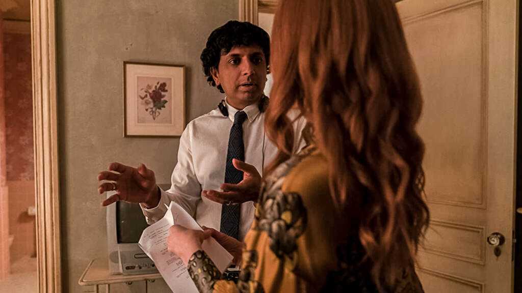 flicks-servant M. Night Shyamalan talking to actress Lauren Ambrose on the set of Servant