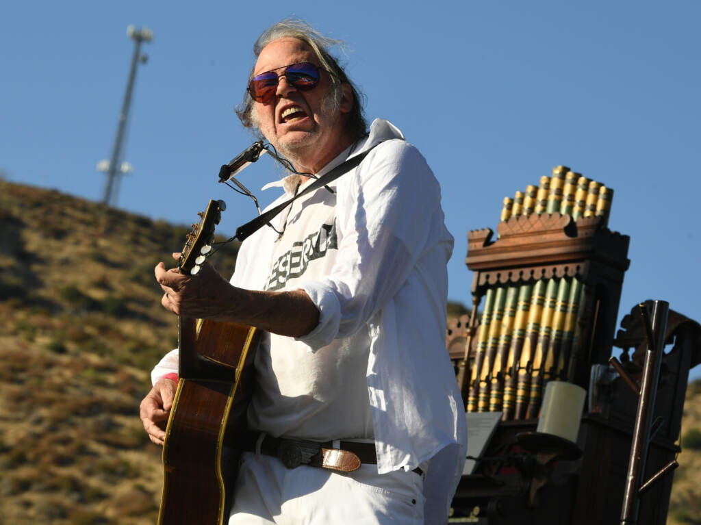 Neil Young, performing in Lake Hughes, Calif. in 2019. Neil Young, performing in Lake Hughes, Calif. in 2019.
(Kevin Winter/Getty Images)