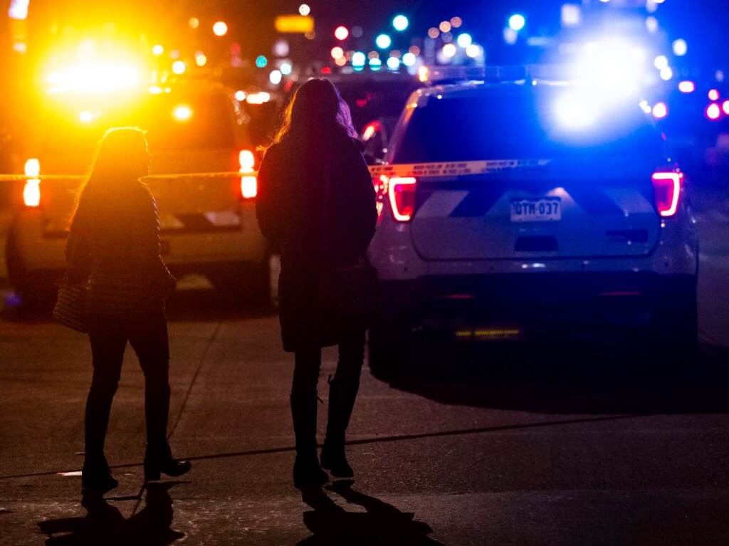 People walk past the Sol Tribe tattoo shop where two women were shot and killed and a man injured on Dec. 27 in Denver, Colo. It was the first in a series of shootings that claimed five lives across the area. People walk past the Sol Tribe tattoo shop on Broadway where two women were shot and killed and a man injured on December 27, 2021 in Denver, Colorado. (Photo by Michael Ciaglo/Getty Images)
