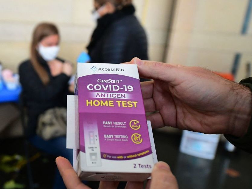 There are several ways older adults can get free rapid antigen tests, but Medicare will not reimburse them when they purchase them. A rapid Covid-19 test kit is displayed after being given out for free to people receiving their Covid-19 vaccines or boosters at Union Station in Los Angeles, California, on January 7, 2022. - Los Angeles County reported more than 37,000 new coronavirus cases on January 6, breaking records again as a regional surge of the Omicron variant continues. (Photo by Frederic J. BROWN / AFP) (Photo by FREDERIC J. BROWN/AFP via Getty Images)