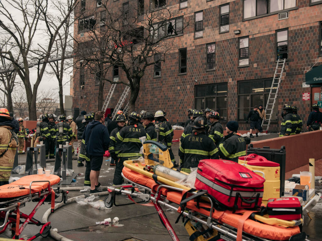 NEW YORK, NY - JANUARY 09: Emergency first responders remain at the scene of an intense fire at a 19-story residential building that erupted in the morning on January 9, 2022 in the Bronx borough of New York City. Reports indicate over 50 people were injured. (Photo by Scott Heins/Getty Images)