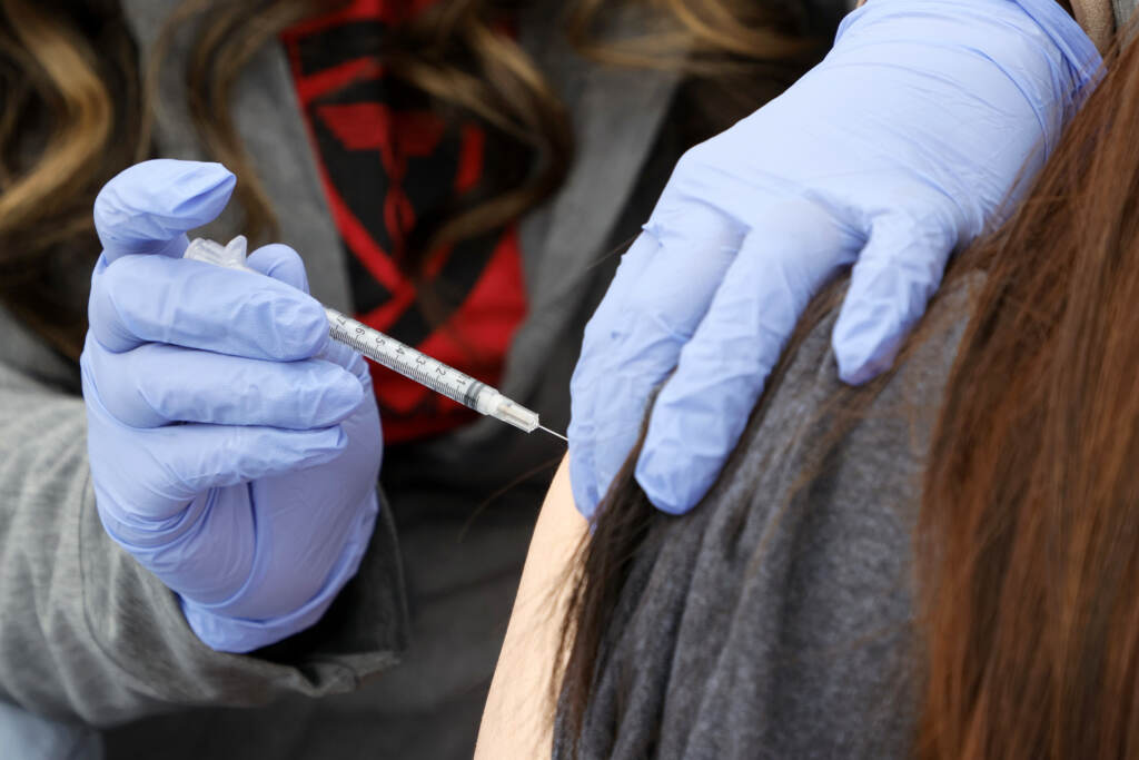 A woman receives a booster shot at a pop-up vaccination clinic in Las Vegas on Dec. 21. A woman receives a booster shot at a pop-up vaccination clinic in Las Vegas on Dec. 21.
(Ethan Miller/Getty Images)
