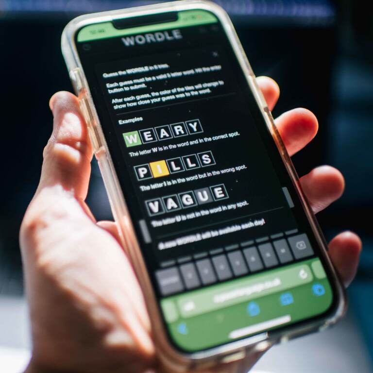 The New York Times has purchased the online word game Wordle has that took off last fall, with people posting their daily scores. (Brandon Bell/Getty Images)