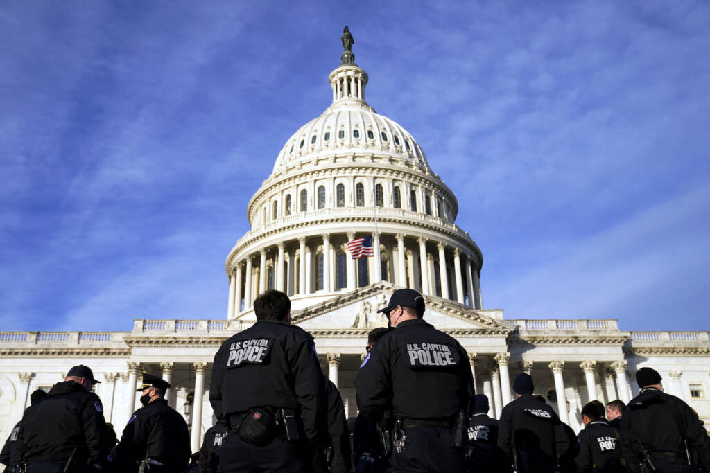 A large group of police arrive at the Capitol