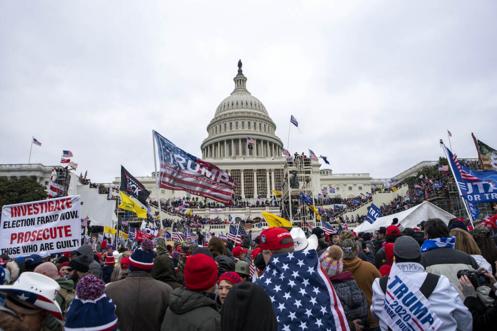 Capitol Riot AP Poll File photo: Rioters loyal to President Donald Trump rally at the U.S. Capitol in Washington on Jan. 6, 2021. (AP Photo/Jose Luis Magana, File)