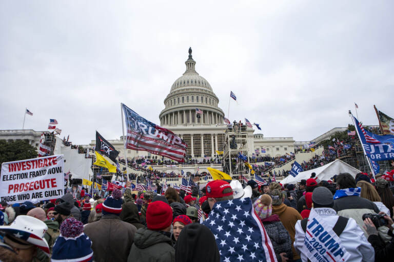 File photo: Rioters loyal to President Donald Trump rally at the U.S. Capitol in Washington on Jan. 6, 2021. (AP Photo/Jose Luis Magana, File)
