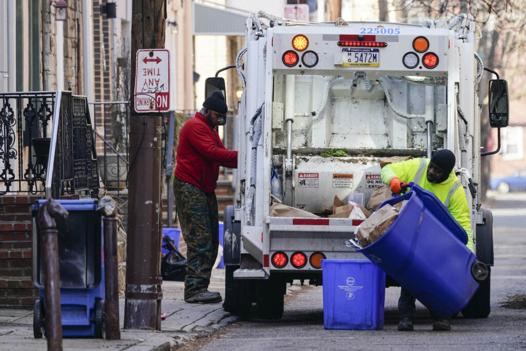 Virus Outbreak Garbage Municipal sanitation workers collect trash in Philadelphia