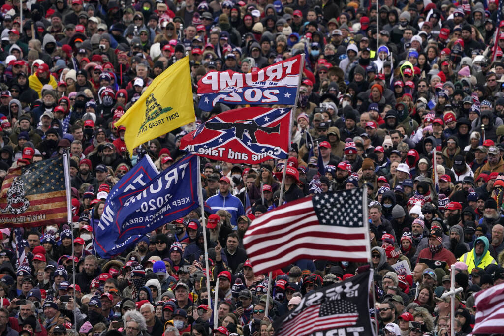 Capitol Riot Remembering People listen as President Donald Trump speaks during the rally that preceded the insurrection