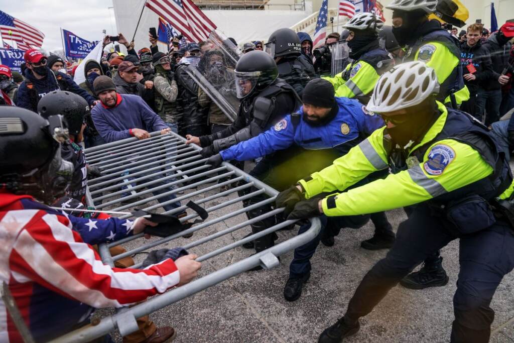 riot FILE - In this file photo from Wednesday Jan. 6, 2021, Trump supporters beset a police barrier at the Capitol in Washington. (AP Photo/John Minchillo, File)