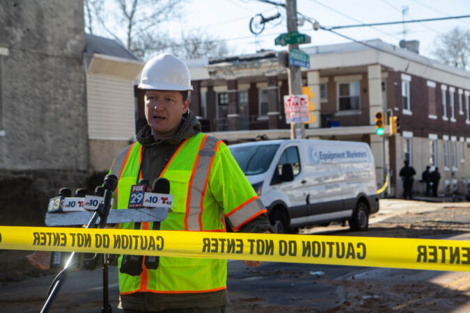 Brian Rademekers speaks while standing at the scene of a water main break