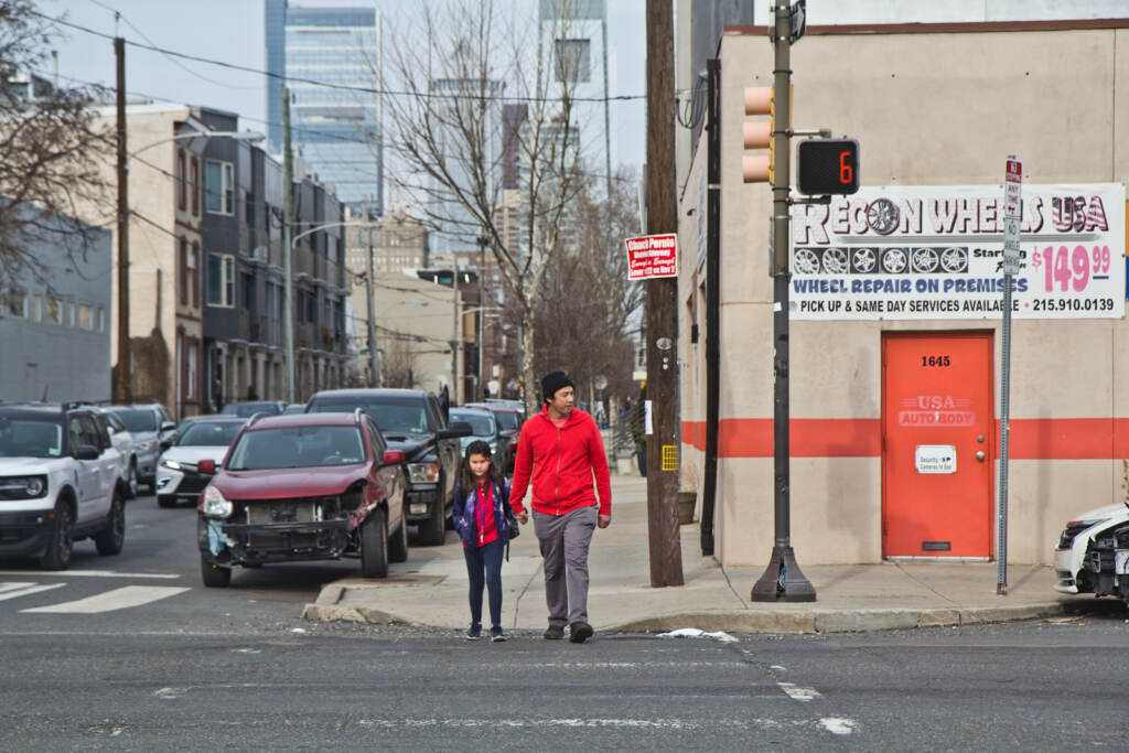 2022 02 16 kpaynter will tung 17th and washington-3 Will Tung and his daughter Juniper cross Washington Avenue.