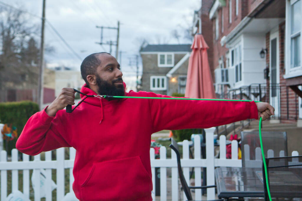 Marcus Morales demonstrated part of his exercise routine outside his home in Philadelphia. (Kimberly Paynter/WHYY)