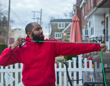 2022 02 25 kpaynter marcus morales-2 Marcus Morales demonstrated part of his exercise routine outside his home in Philadelphia. (Kimberly Paynter/WHYY)