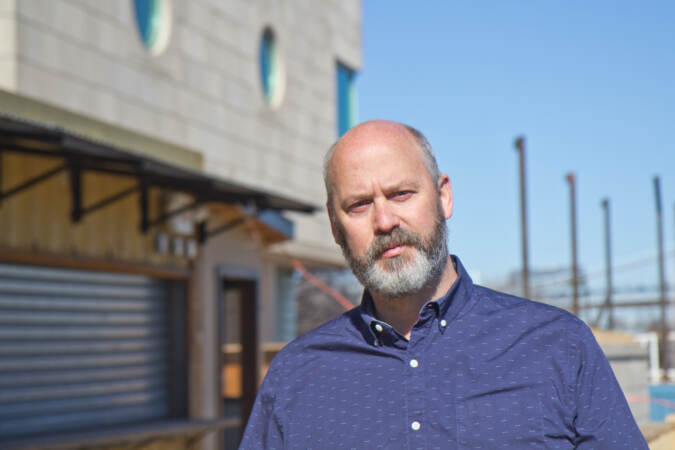 Avram Hornik stands outside Liberty Point