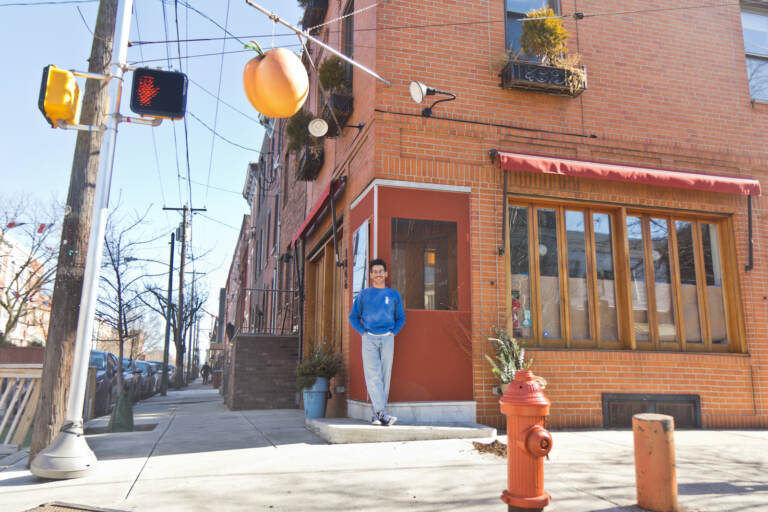 Alex Tewfik stands outside his restaurant