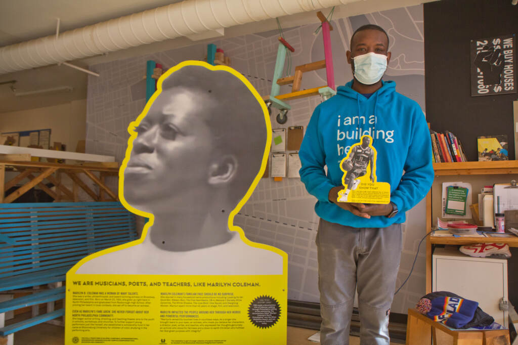 2022 2 3 k paynter FGF play everywhere sharswood-7 Creator and North Philadelphia resident Ian Lipford holds a prototype of an installation of Mike Green, a basketball player from the neighborhood who went on to win awards as a college player. (Kimberly Paynter/WHYY)