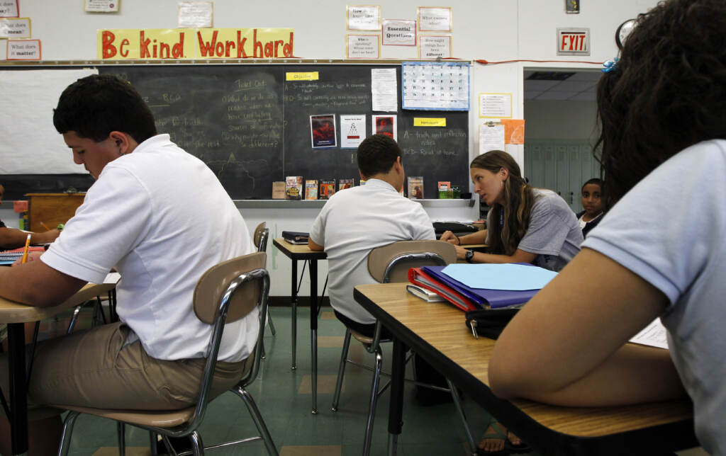 Laura Kanagy Teacher Laura Kangay, (center) helps a student with his reading at Lincoln Middle School Friday, Sept. 30, 2011 in Lancaster, Pa. Financial woes have forced school districts to shed thousands of teaching jobs, adopt a four-day school week and cut electives such as art. And the budget situation probably wont improve any time soon for school districts that rely heavily on state and local tax dollars. But what might happen in a best-case financial scenario that assumes strong economic growth next year?