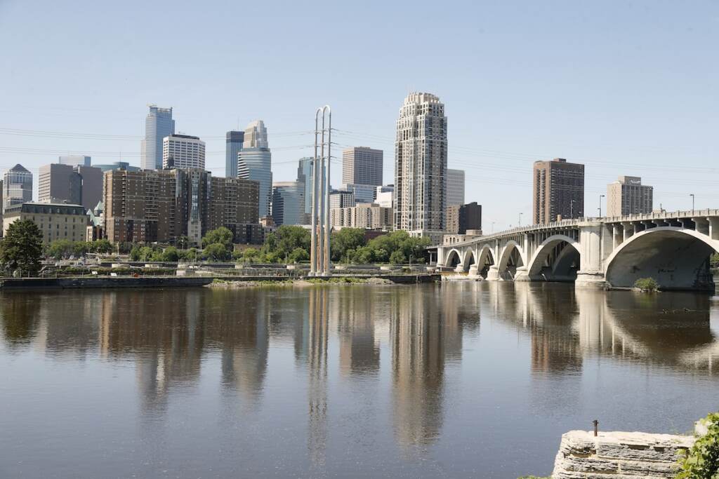 Minneapolis Skyline File photo: The Minneapolis skyline is shown Thursday, July 11, 2019, behind the Mississippi River. (AP Photo/Jim Mone)