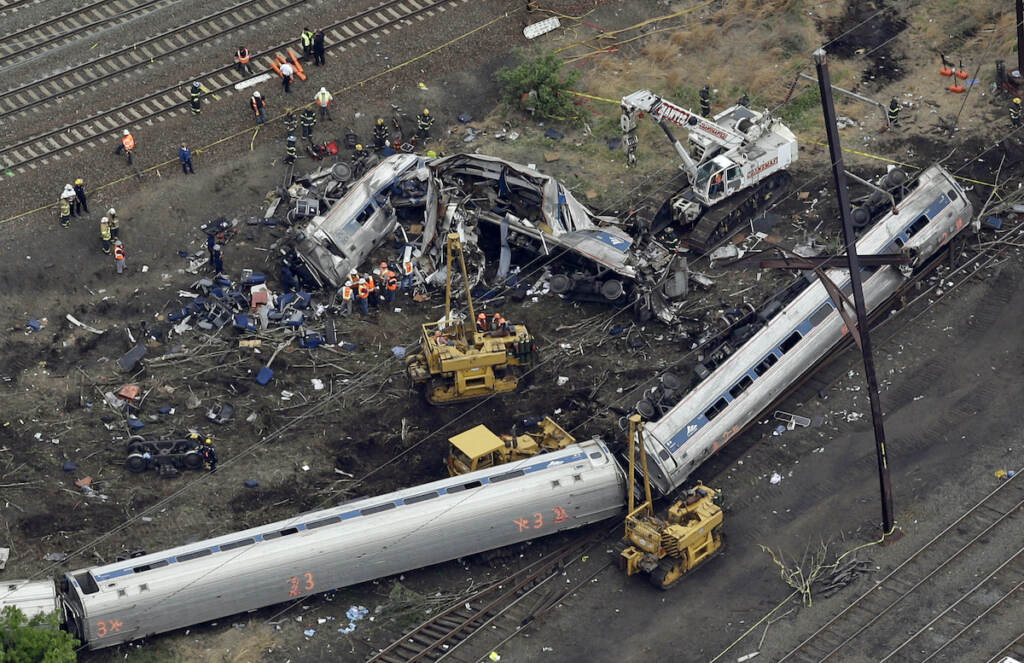 Amtrak Crash Philadelphia In this May 13, 2015, file photo, emergency personnel work near the wreckage of a New York City-bound Amtrak passenger train following a derailment that killed eight people and injured about 200 others in Philadelphia