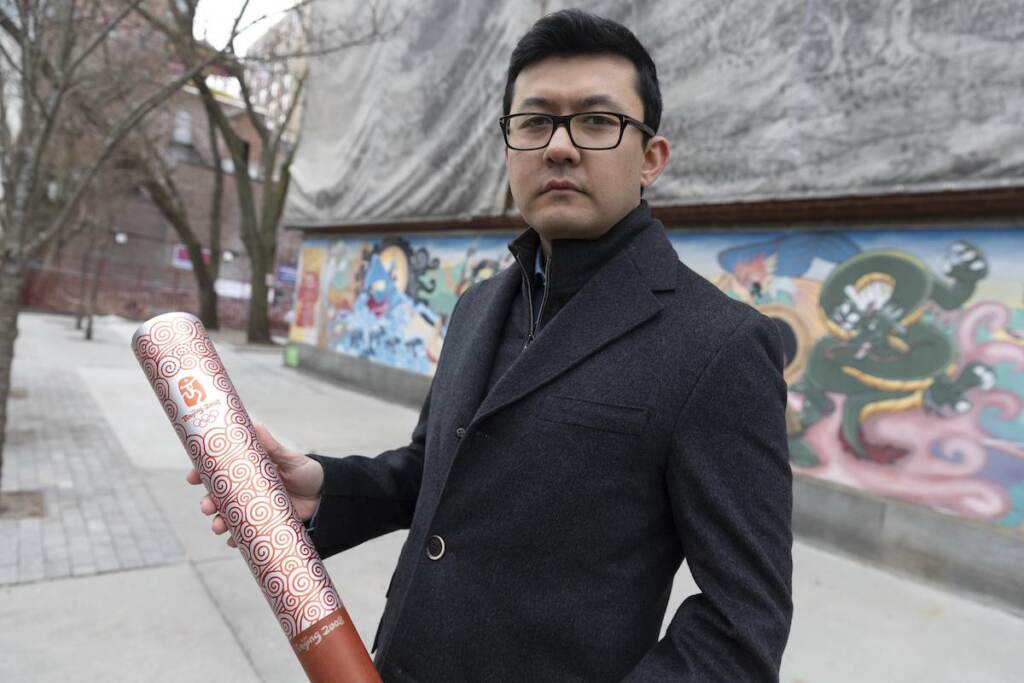 Kamalt√ºrk Yalqun Kamaltürk Yalqun holds the aluminium Olympics torch he carried at the 2008 Beijing Olympic Games at the age of 17, on Friday, Jan. 28, 2022, in Boston. The decade after the Games saw Beijing impose policies on his region of Xinjiang that split apart his family and Uyghur community. Today, he is an activist in the United States calling for a boycott of the 2022 Winter Games, which will see the Olympic flame returned to Beijing.