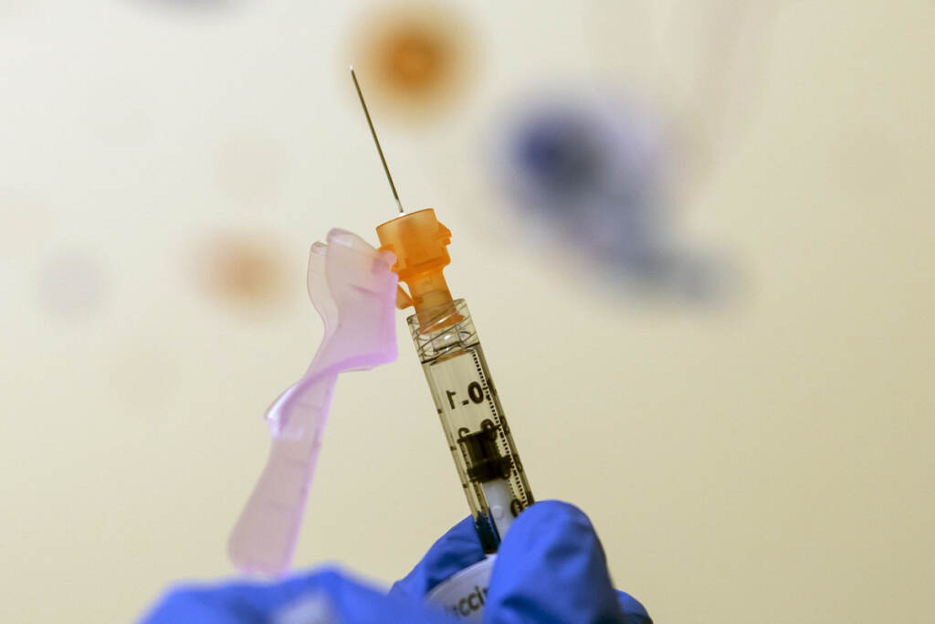 Lydia Holly File photo: Nurse Lydia Holly prepares a child's COVID-19 vaccine dose, on Nov. 3, 2021, at Children's National Hospital in Washington. (AP Photo/Carolyn Kaster, File)