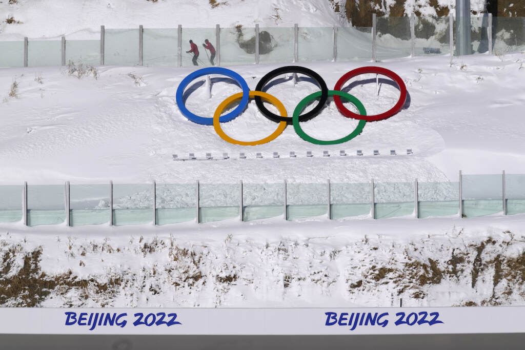 Beijing Olympics Biathlon Biathletes skate above the Olympic rings during practice at the 2022 Winter Olympics, Thursday, Feb. 3, 2022, in Zhangjiakou, China. (AP Photo/Kirsty Wigglesworth)