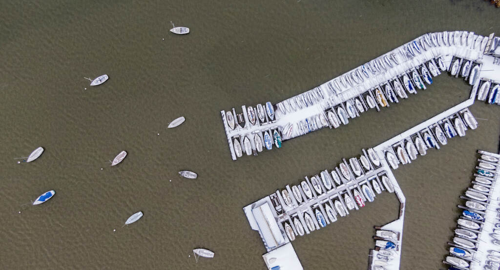 APTOPIX Winter Weather Texas Boats are covered with ice and snow at White Rock Lake, Thursday, Feb. 3, 2022, in Dallas. (AP Photo/Brandon Wade)