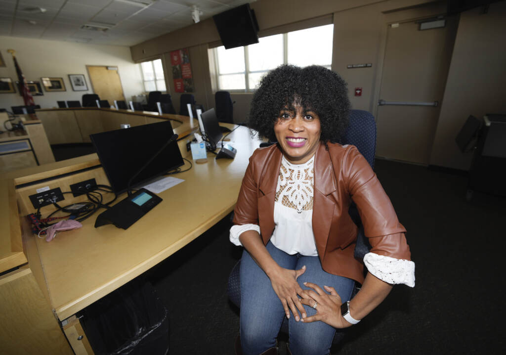 Schools-Equity Battles Hold For Use With Michael Melia Story Slugged Schools Teaching Race—In this Friday, Feb. 4, 2022, photograph, Alexis Knox-Miller, equity director for the Colorado Springs, Colo., school system, is shown in the board room in the district’s main office on the north side of Colorado Springs, Colo. (AP Photo/David Zalubowski)