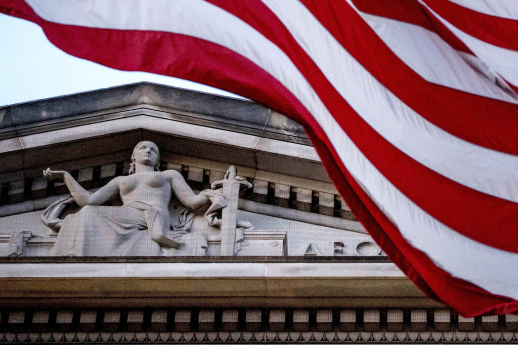 Professor Secrets Lawsuit An American flag flies outside the Department of Justice in Washington, Friday, March 22, 2019. Special counsel Robert Mueller has concluded his investigation into Russian election interference and possible coordination with associates of President Donald Trump. The Justice Department says Mueller delivered his final report to Attorney Barr, who is reviewing it. (AP Photo/Andrew Harnik)