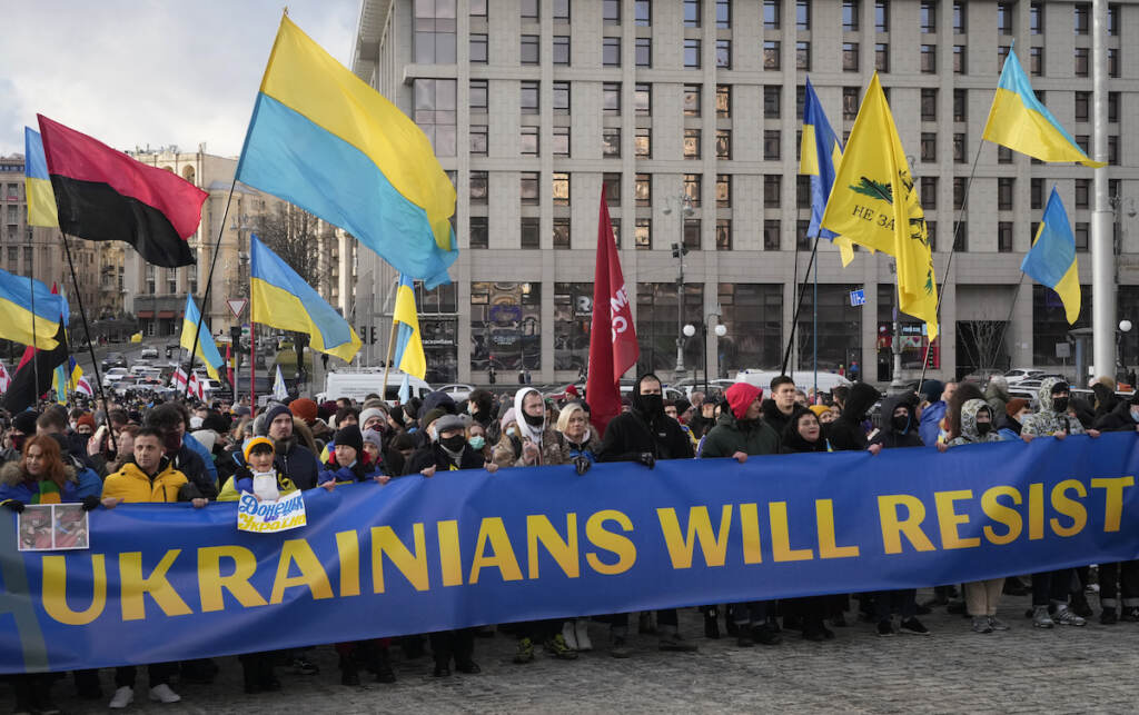 Ukraine Tensions Ukrainians attend a rally in central Kyiv, Ukraine, Saturday, Feb. 12, 2022, during a protest against the potential escalation of the tension between Russia and Ukraine. Russian President Vladimir Putin and U.S. President Joe Biden are to hold a high-stakes telephone call on Saturday as tensions over a possibility imminent invasion of Ukraine escalated sharply and the U.S. announced plans to evacuate its embassy in the Ukrainian capital