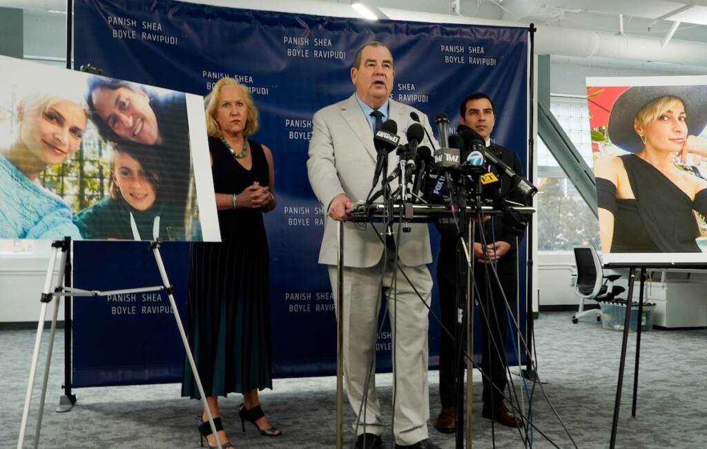 AP22046681176130 (1) (From left) Randi McGinn, Brian Panish and Jesse Creed, attorneys for the family of the late cinematographer Halyna Hutchins, take part in a news conference alongside portraits of Hutchins and her family, Tuesday, Feb. 15, 2022, in Los Angeles. The family of Hutchins is suing Alec Baldwin and the movie producers of “Rust” for wrongful death, the attorneys said Tuesday