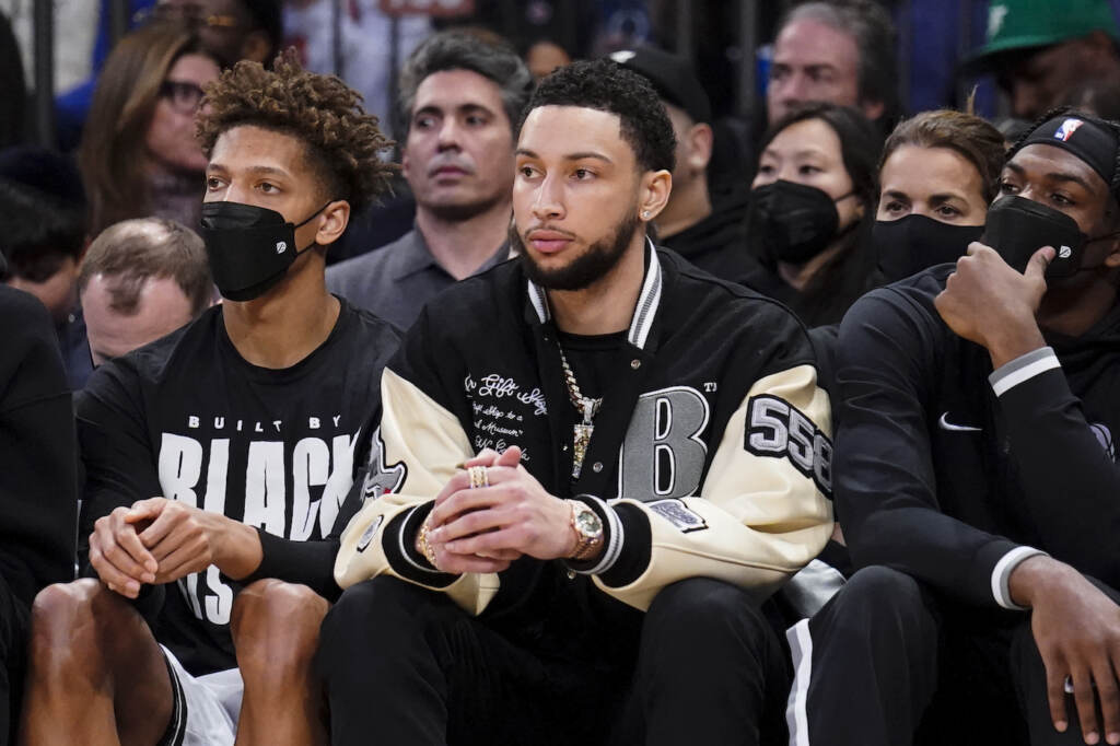 Nets Knicks Basketball Brooklyn Nets forward Ben Simmons sits on the bench during the second half of an NBA basketball game against the New York Knicks, Wednesday, Feb. 16, 2022, in New York. (AP Photo/John Minchillo)