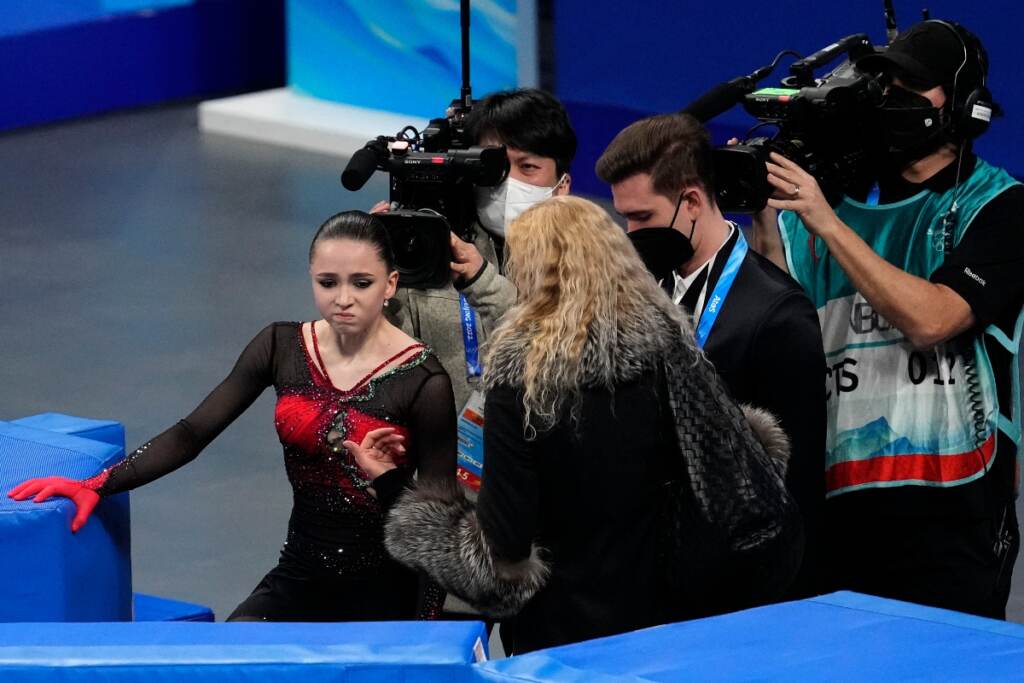 AP22048529071464 (1) Kamila Valieva, of the Russian Olympic Committee, talks with her coach Eteri Tutberidze after the women's free skate program during the figure skating competition at the 2022 Winter Olympics, Thursday, Feb. 17, 2022, in Beijing